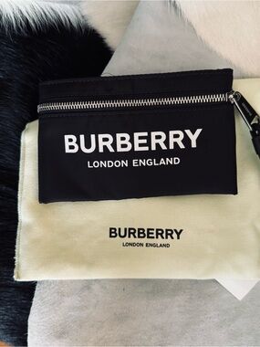 Burberry , Arm wallet with Black elastic back .